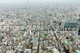 An aerial view over an endless urban grid in the haze 