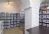 An archive in the vaulted basement with a pillar in the centre